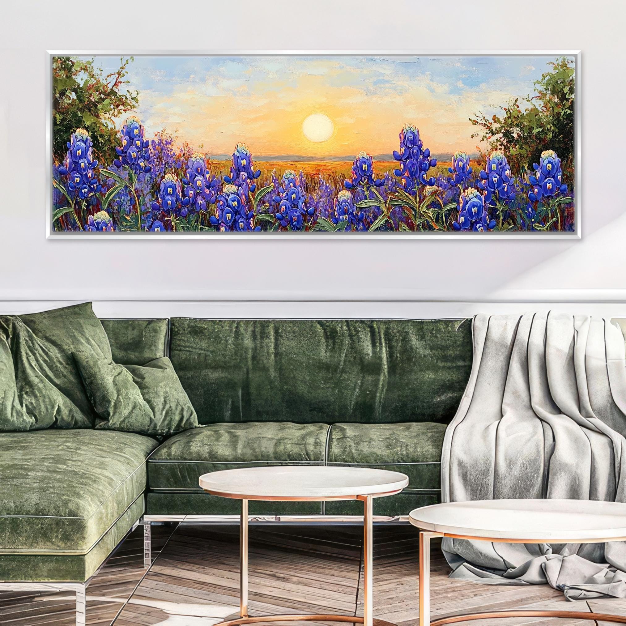 a living room with a green couch and a painting on the wall