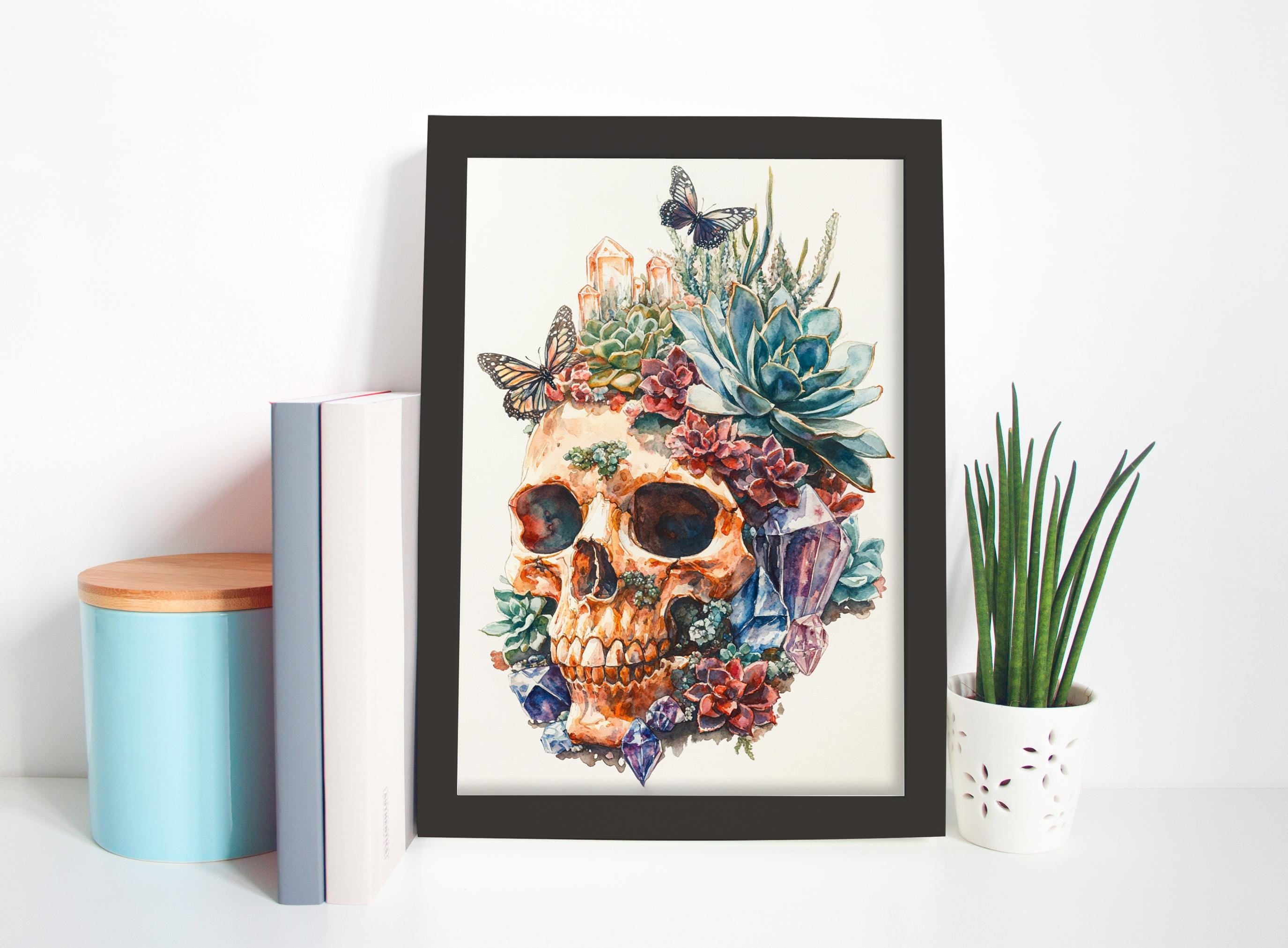 a framed artwork depicting a skull surrounded by a vibrant array of colorful flowers and plants, creating a striking and visually captivating scene.