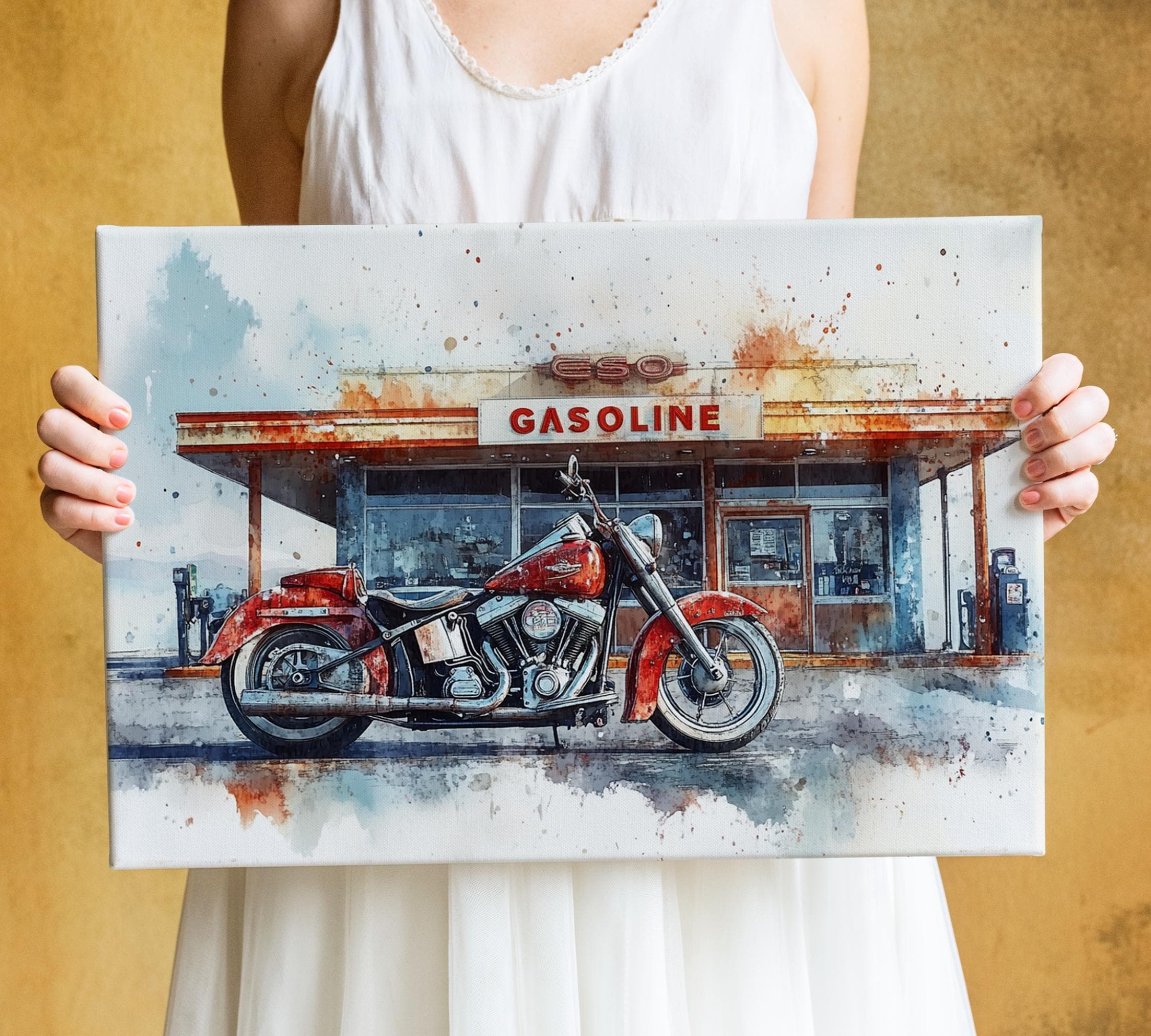 A person is holding a framed painting of a red motorcycle in front of a gas station.