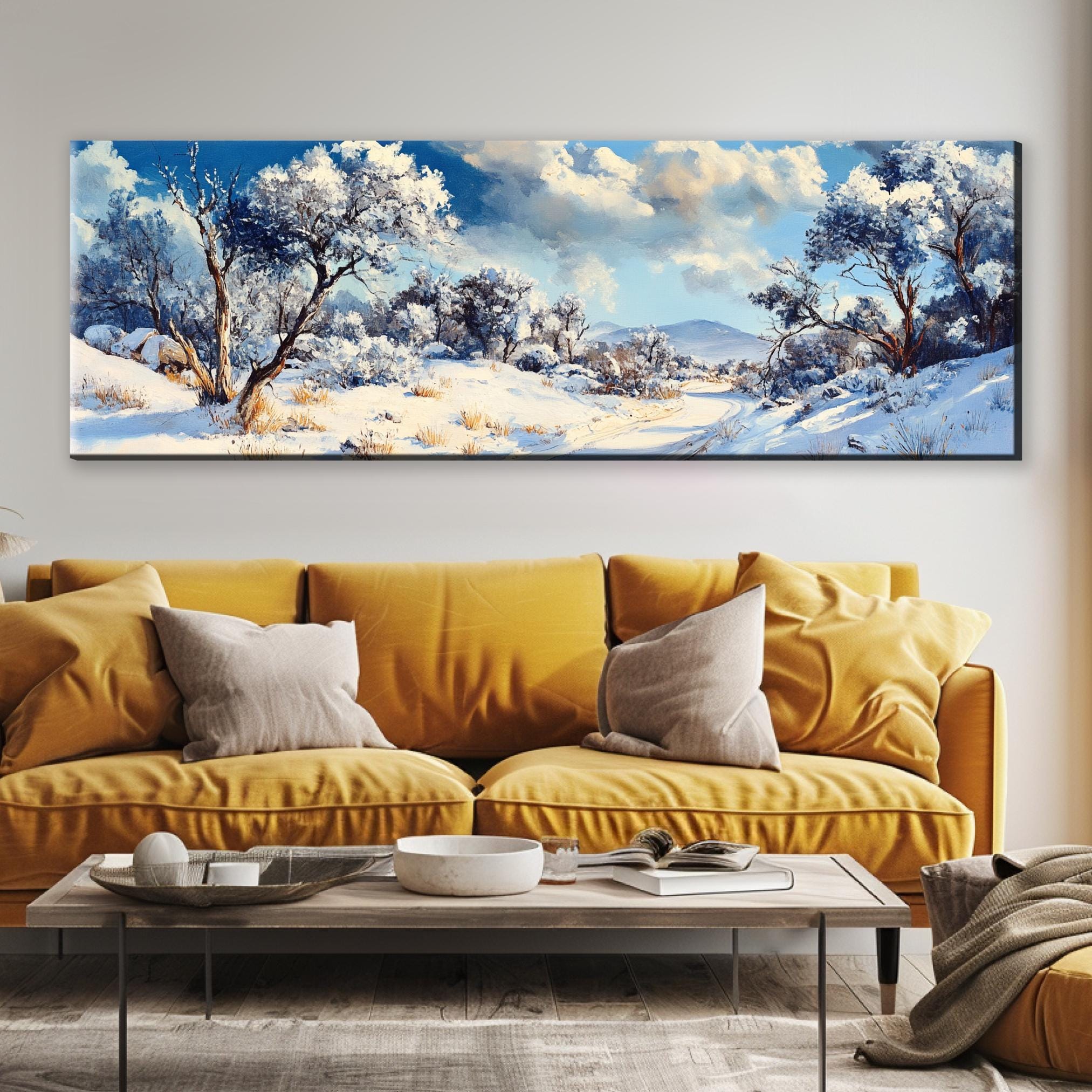 a living room with a couch and a painting on the wall