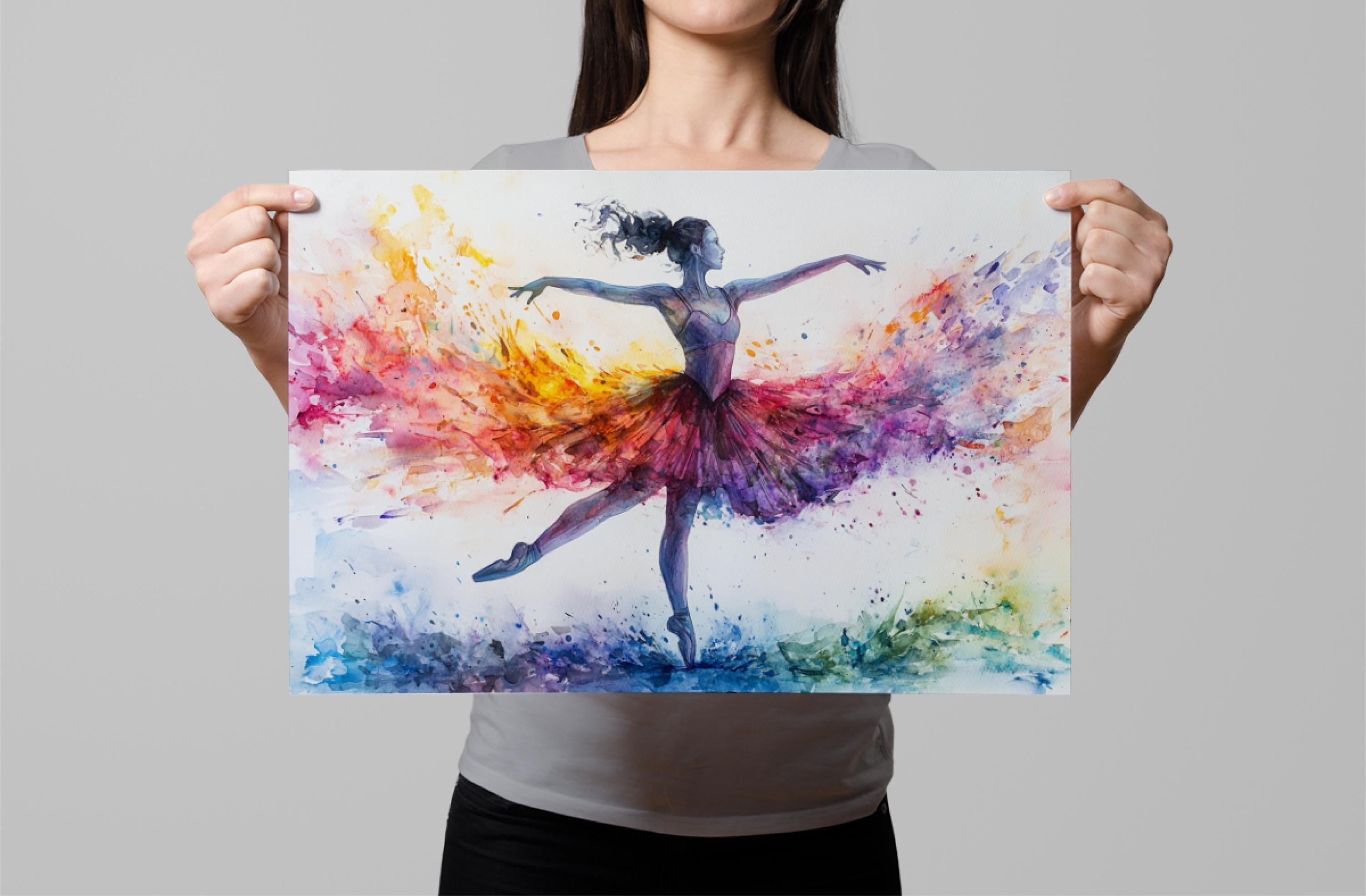 A woman is holding up a colorful painting of a ballerina in a tutu, with her arms outstretched and her hair flowing.