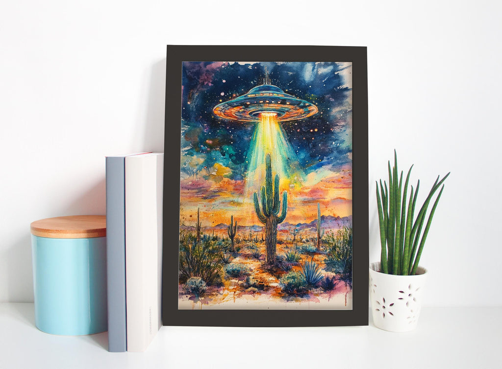 a framed painting of a desert landscape with a cactus and an alien spacecraft hovering above it, set against a colorful, starry sky.