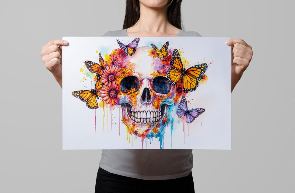 A woman holds up a colorful, artistic print featuring a skull surrounded by butterflies and flowers.