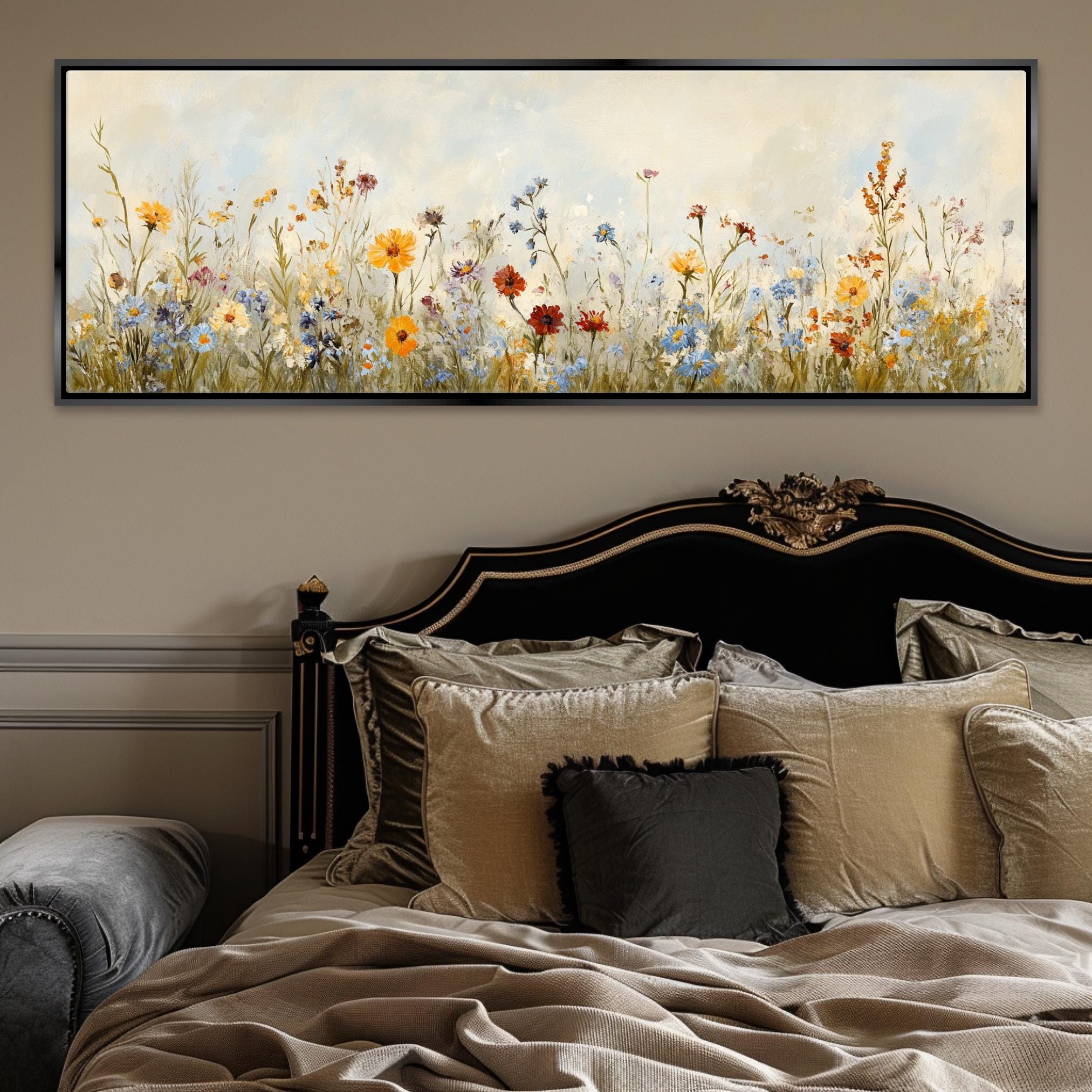 a bed with a painting on the wall above it