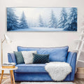 a living room with a blue couch and a painting on the wall