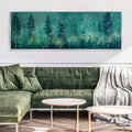 a living room with a green couch and a painting on the wall