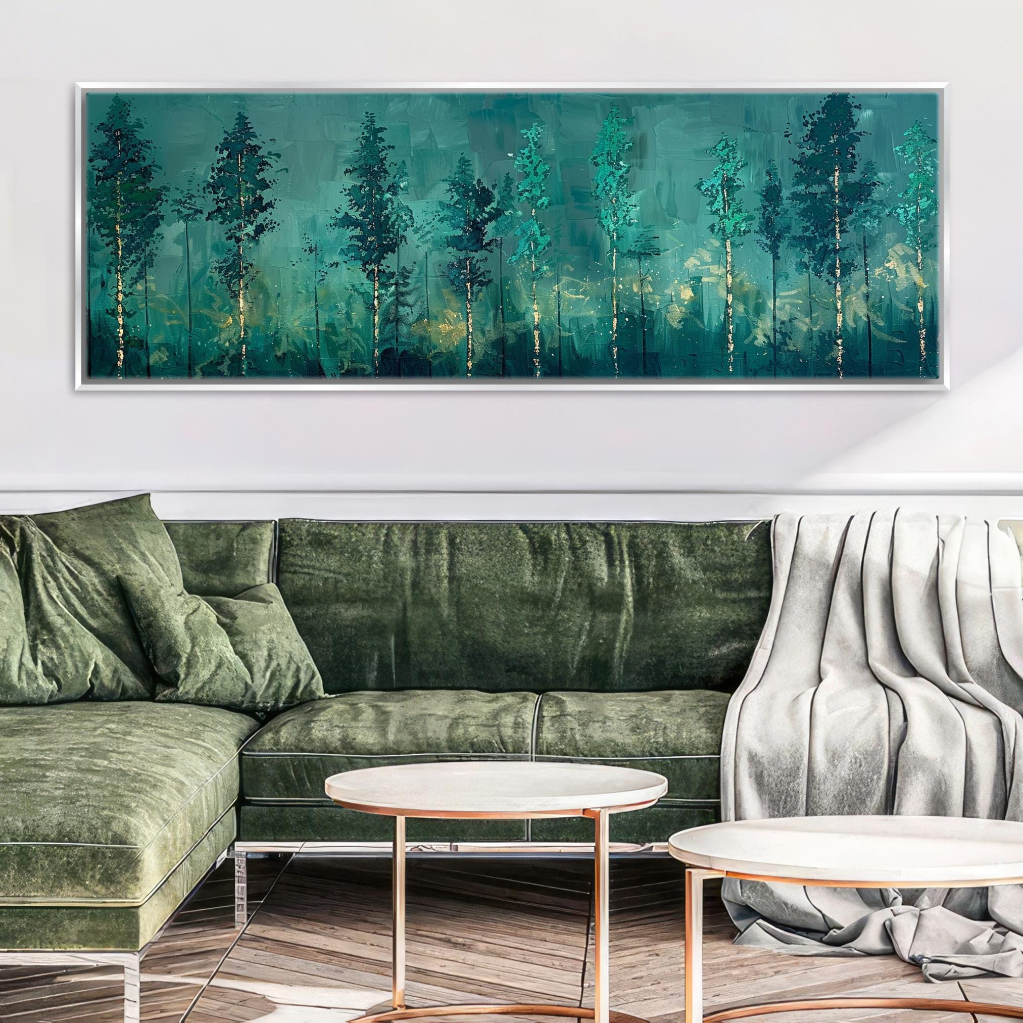 a living room with a green couch and a painting on the wall