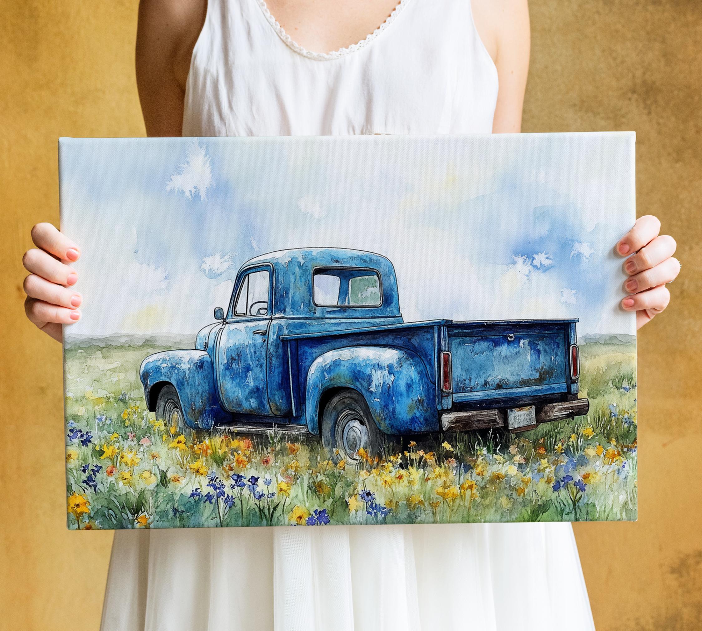A woman holds a painting of an old blue pickup truck in a field of flowers.