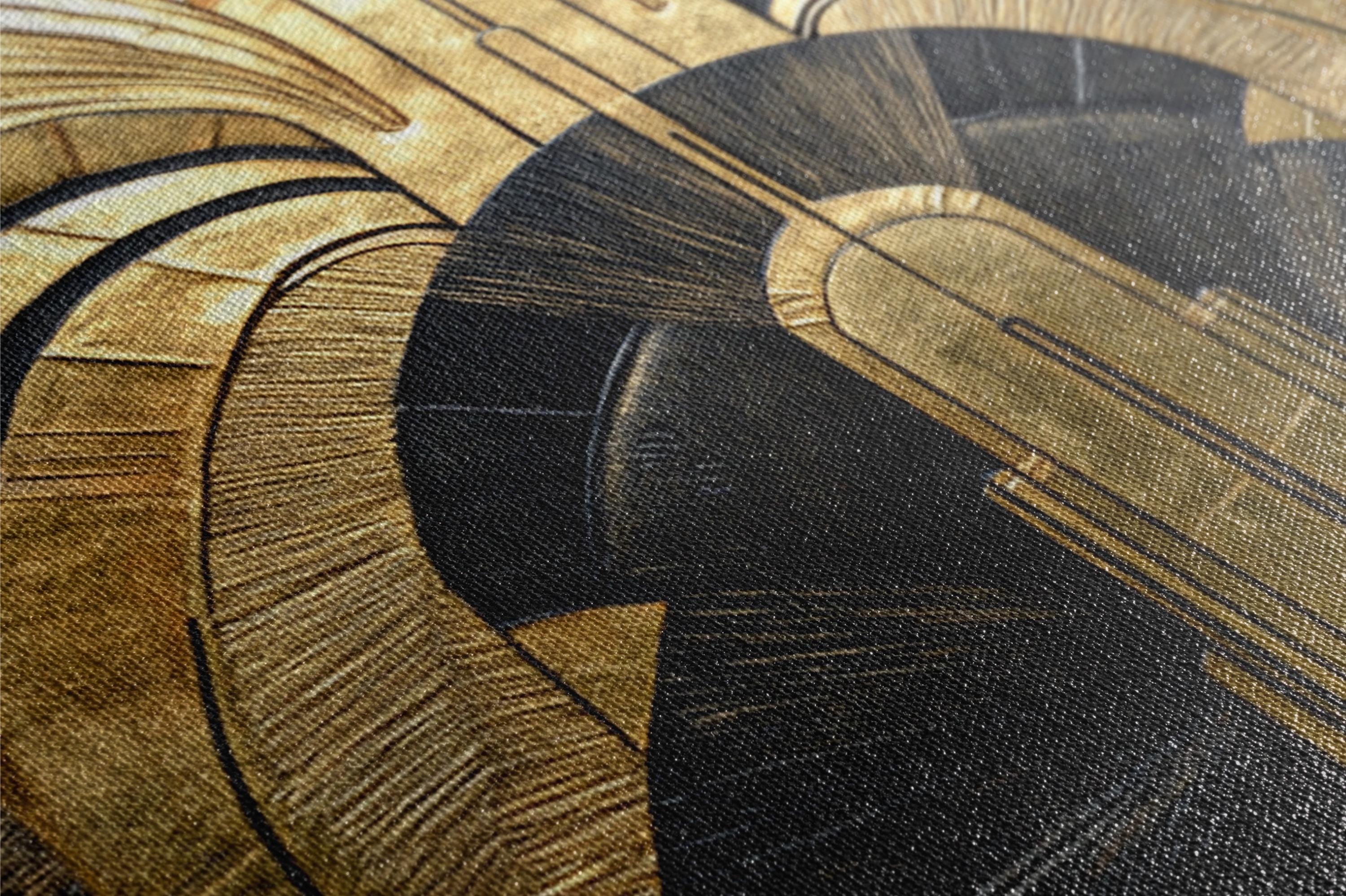 a close up of a gold and black painting