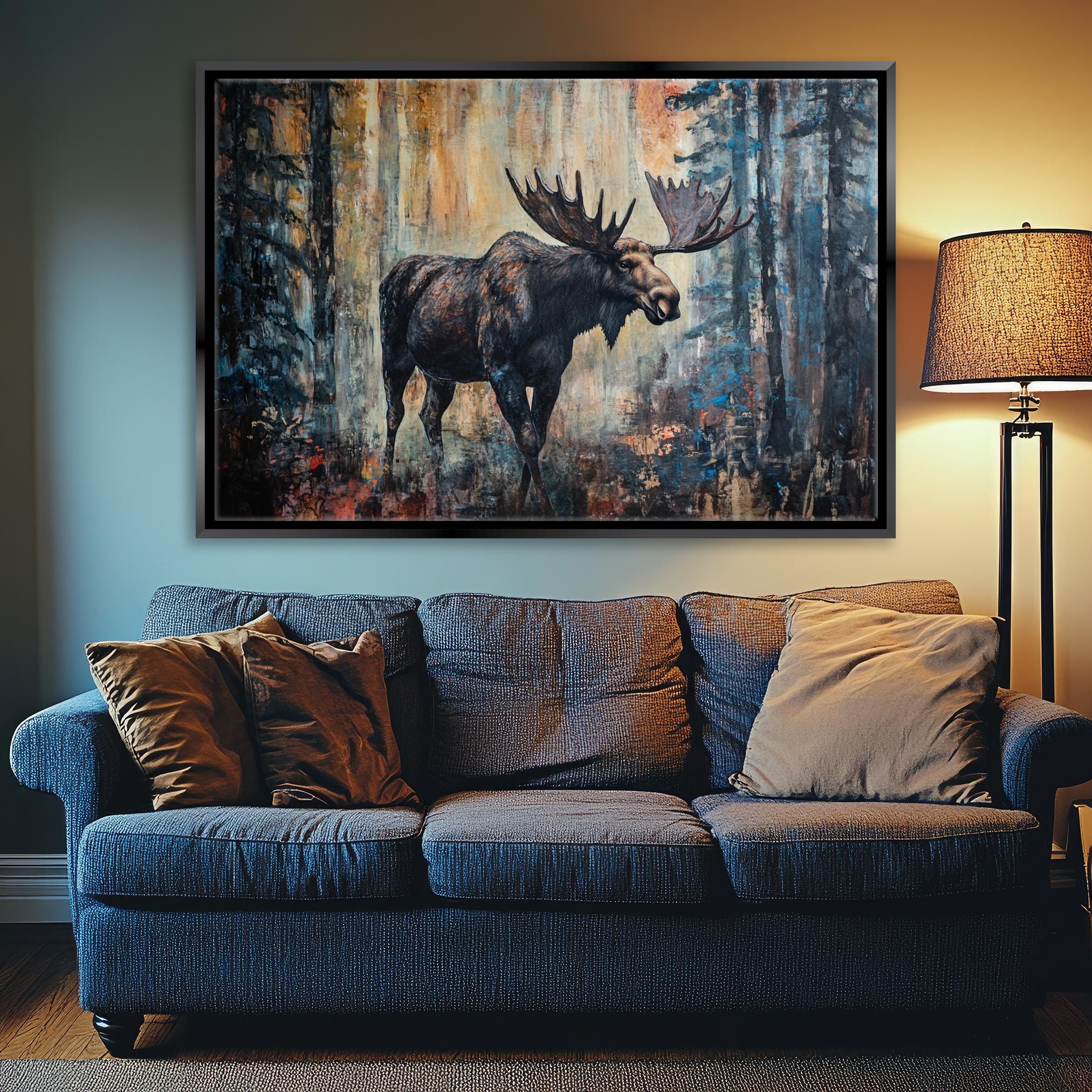 a living room with a couch and a painting of a moose