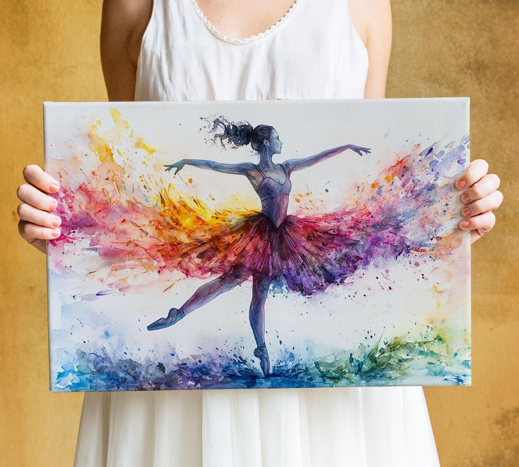A woman is holding a colorful painting of a ballerina in a tutu, with vibrant splashes of color surrounding her.