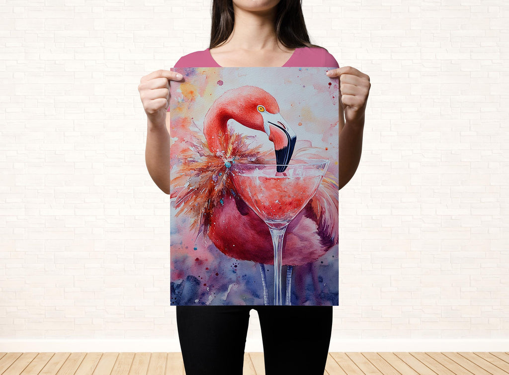 A woman holds up a framed painting of a flamingo with a martini glass in front of it.