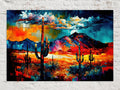The image is a vibrant, colorful painting depicting a desert landscape with towering cacti in the foreground and a majestic mountain range in the background. The painting features a mix of warm and cool colors, creating a visually striking and dynamic scene.