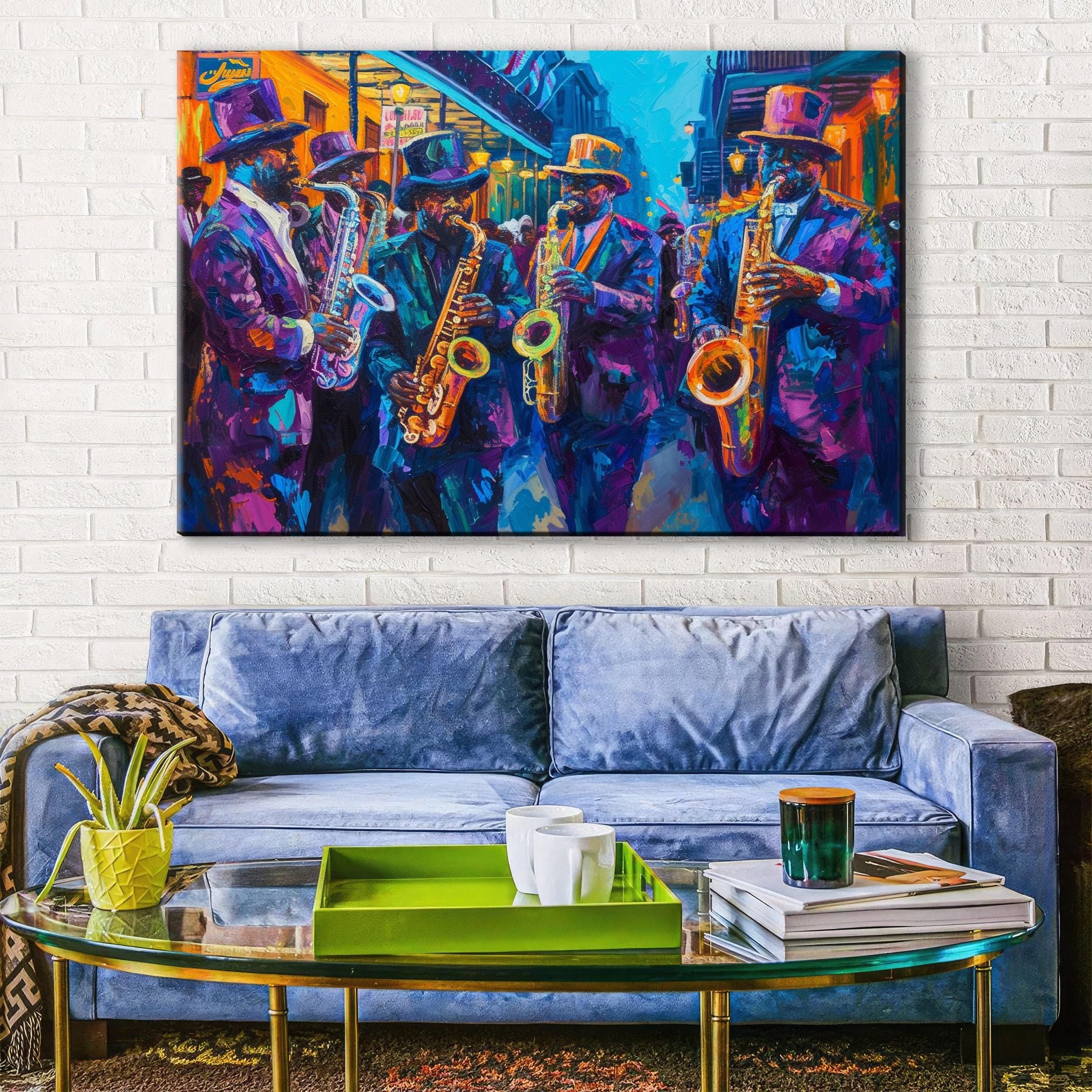 a vibrant painting of a group of musicians playing saxophones, set against a colorful backdrop of a city street. The painting is hung on a white brick wall above a blue couch, which is positioned in front of a glass coffee table. The table is adorned with a green tray and a stack of books, creating a cozy and inviting atmosphere in the living room.