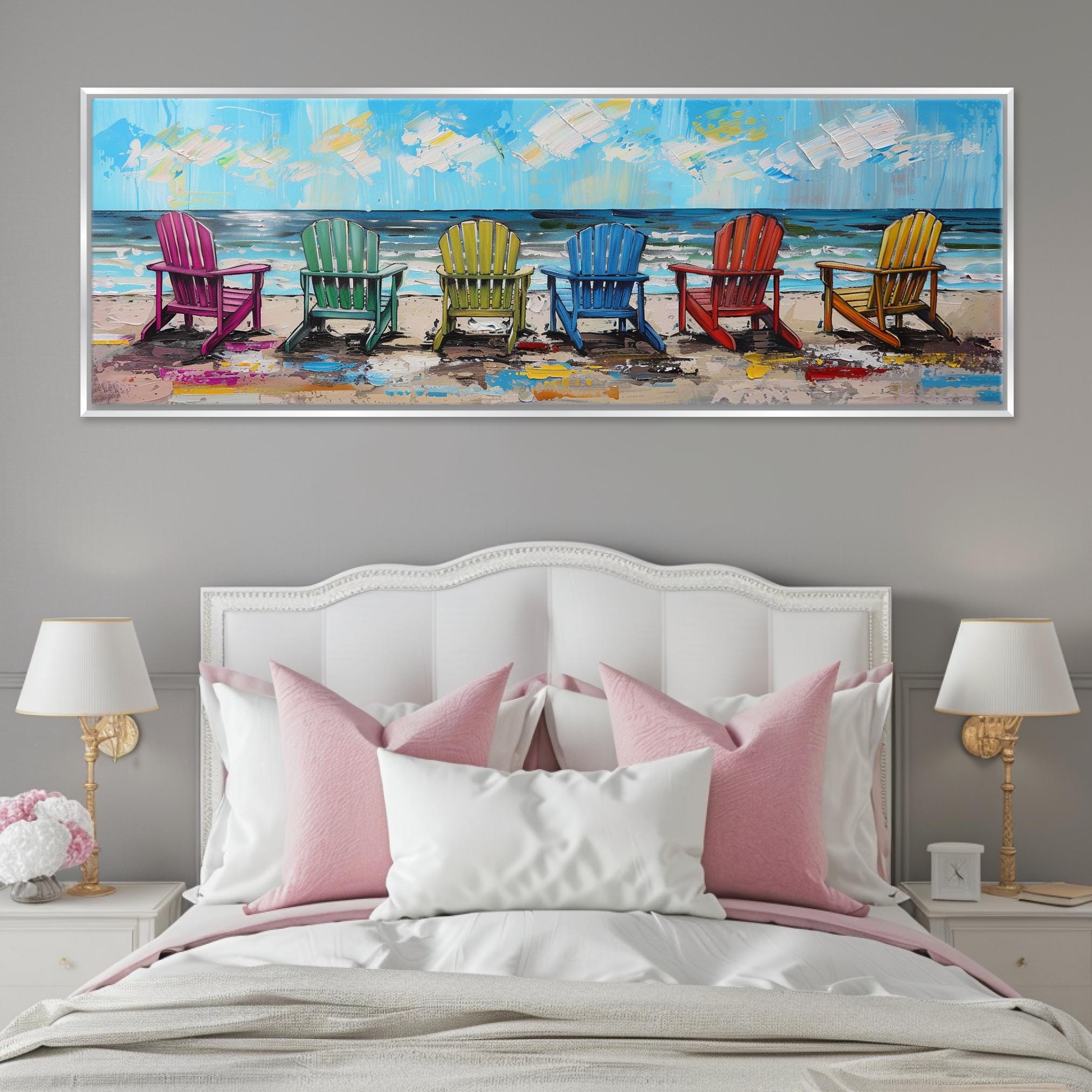 a bed with a white headboard and a painting on the wall above it