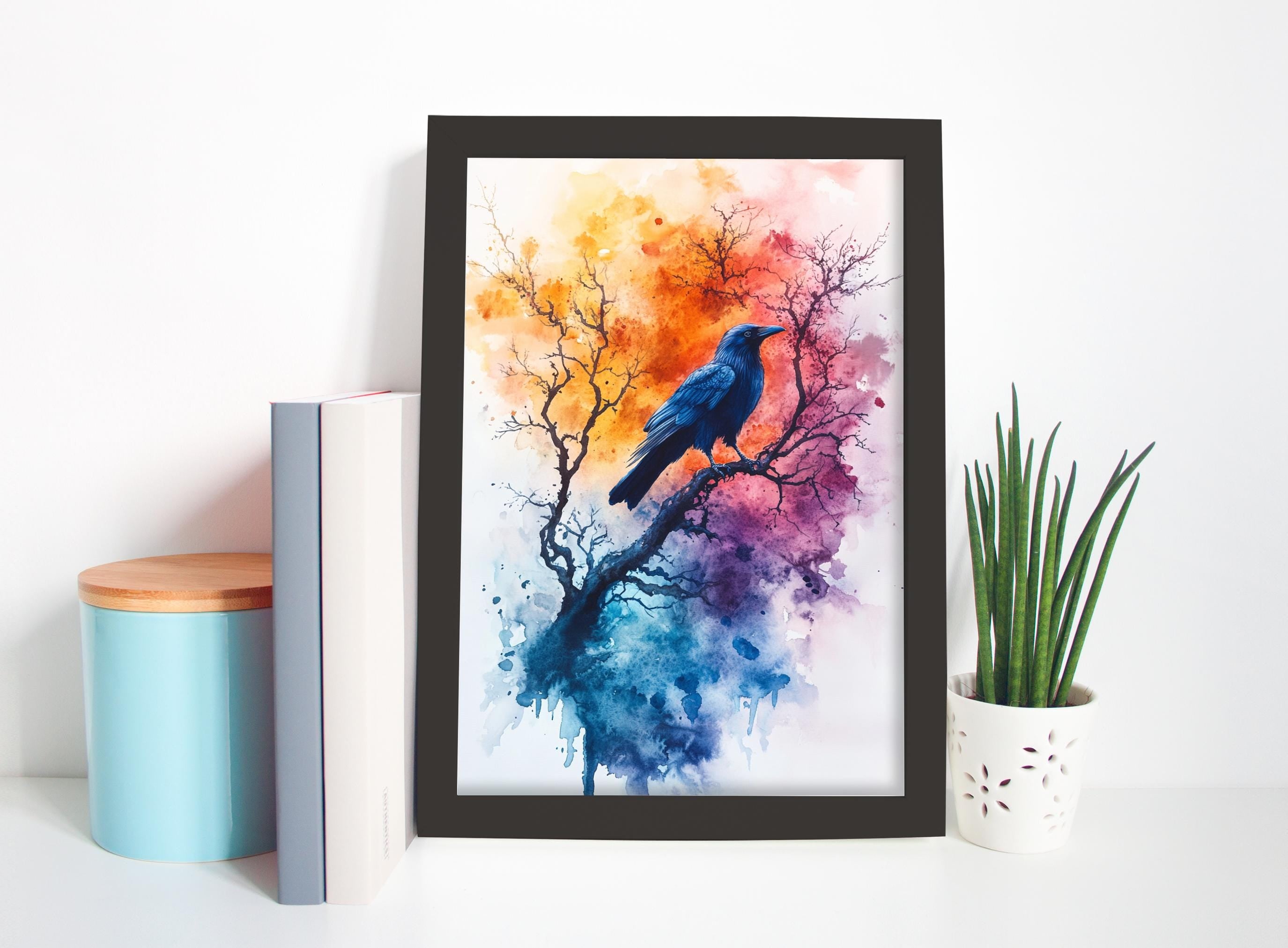 a framed painting of a blue bird perched on a tree branch, with a colorful, abstract background. The painting is displayed on a white shelf, accompanied by a blue container, a white vase with green plants, and a stack of books.
