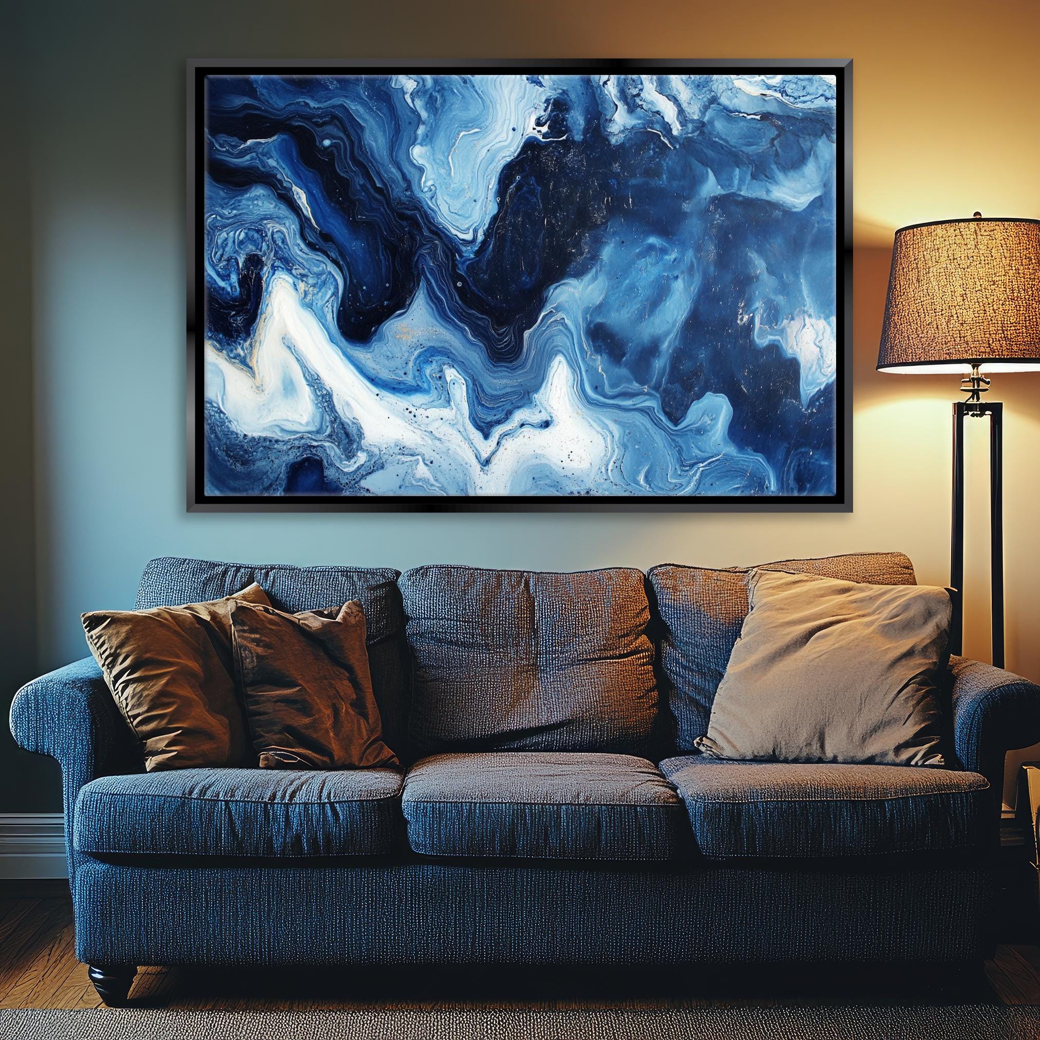 a living room with a couch and a painting on the wall
