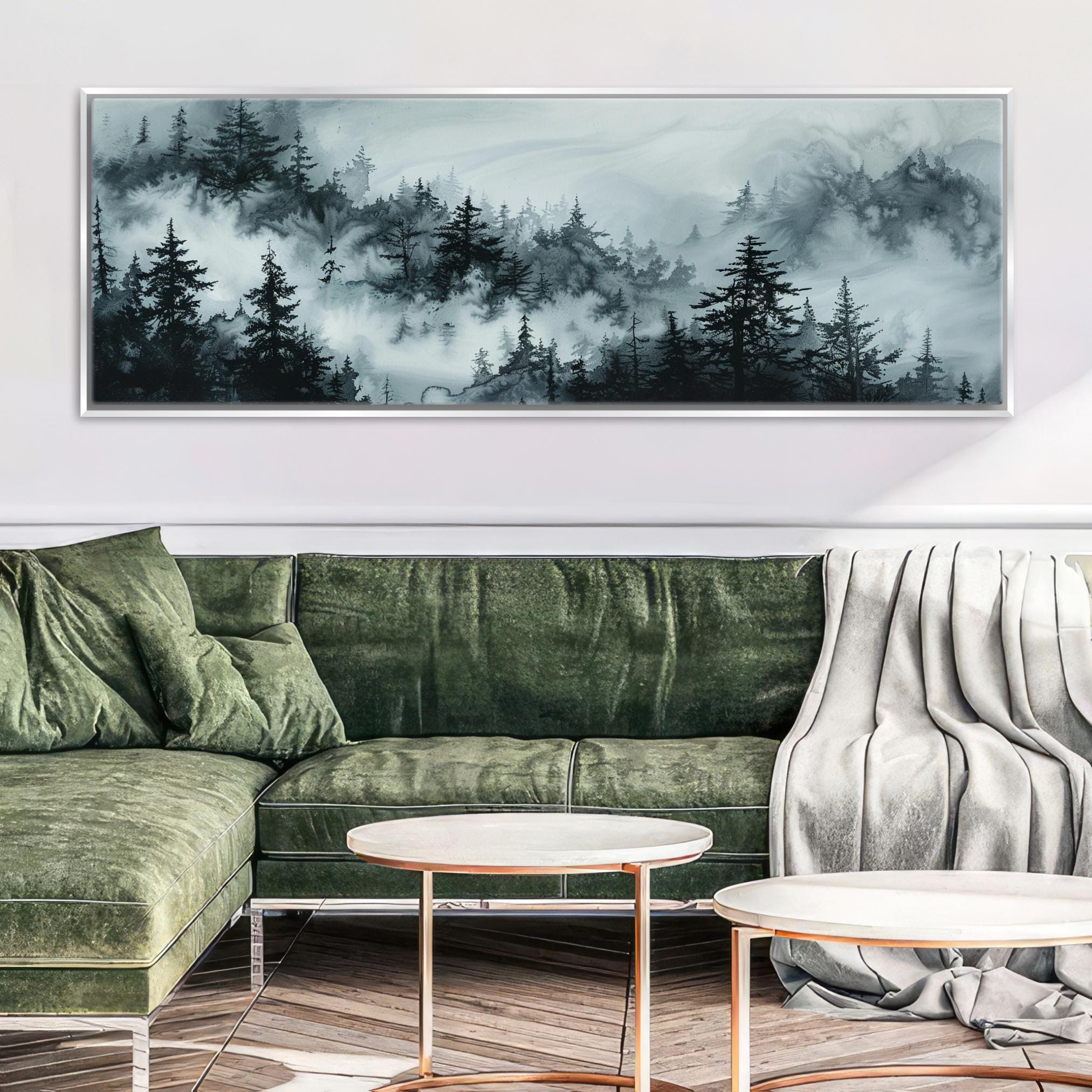 a living room with a green couch and a painting on the wall