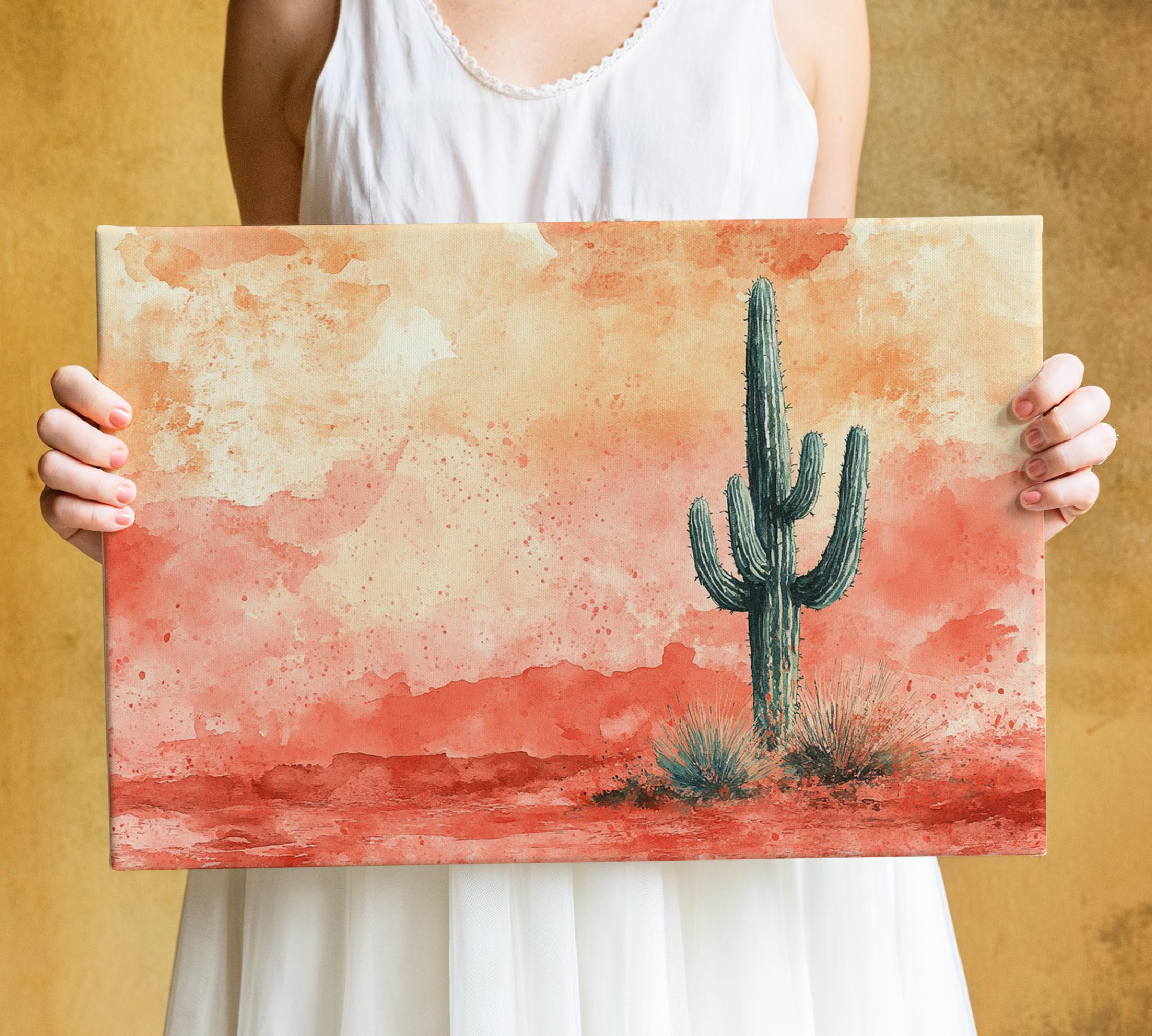 A woman holds a watercolor painting of a cactus against a desert landscape with a warm, reddish-orange background.