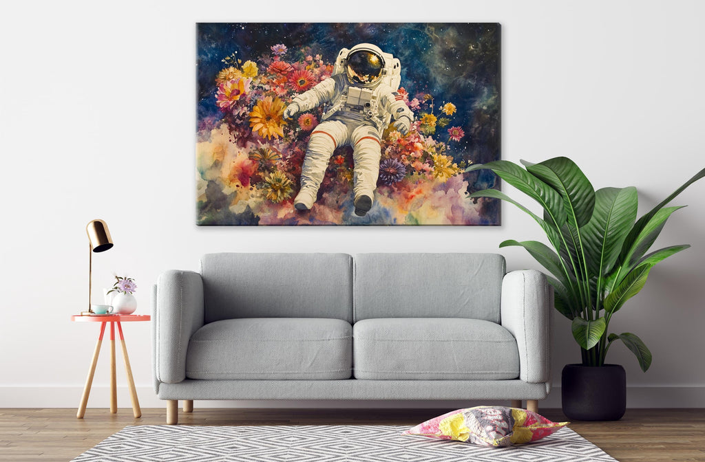 a gray sofa, a potted plant, and a large painting of an astronaut floating in a colorful flower field.