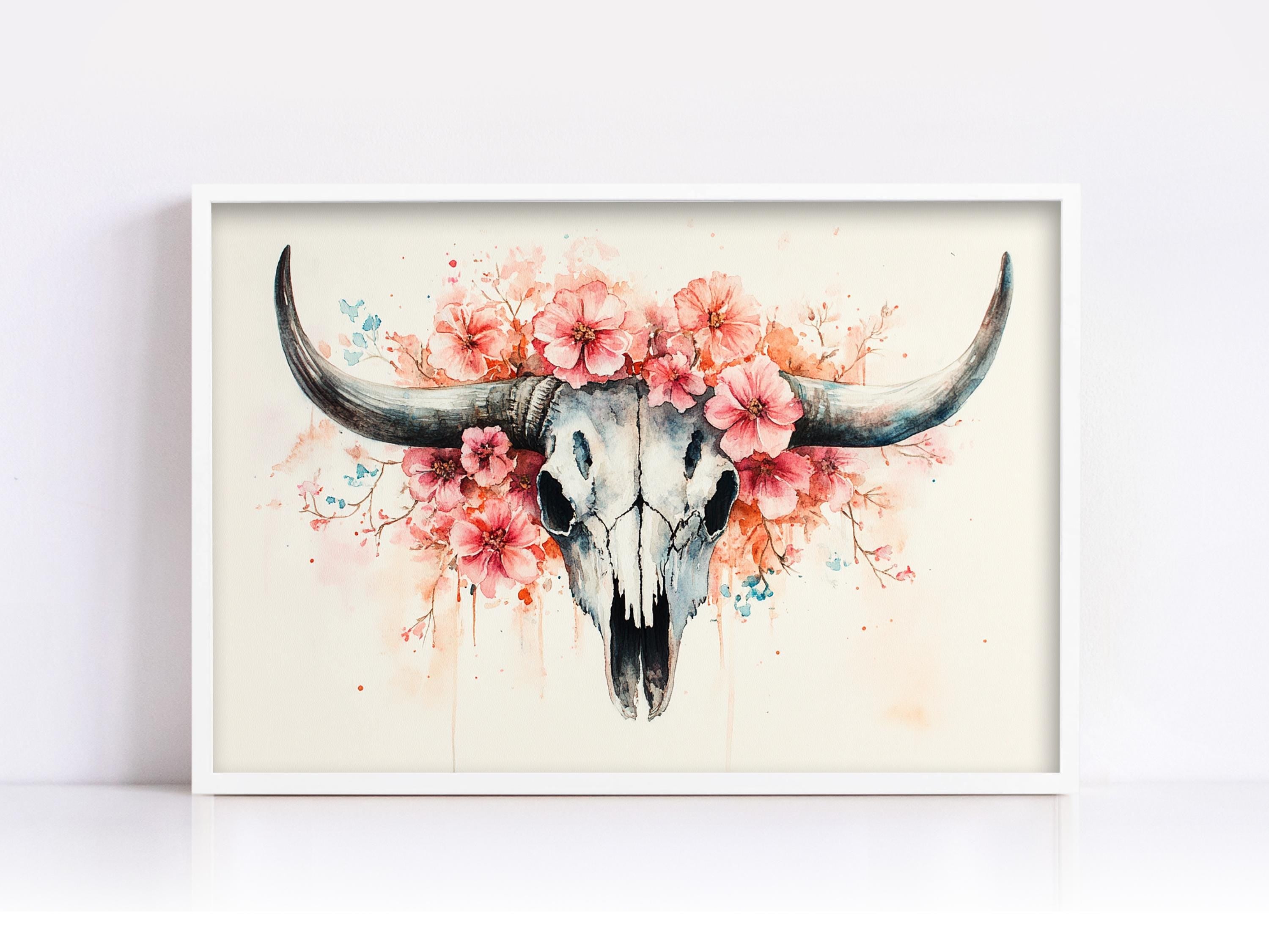 A framed painting depicting a skull with large horns, surrounded by pink flowers.