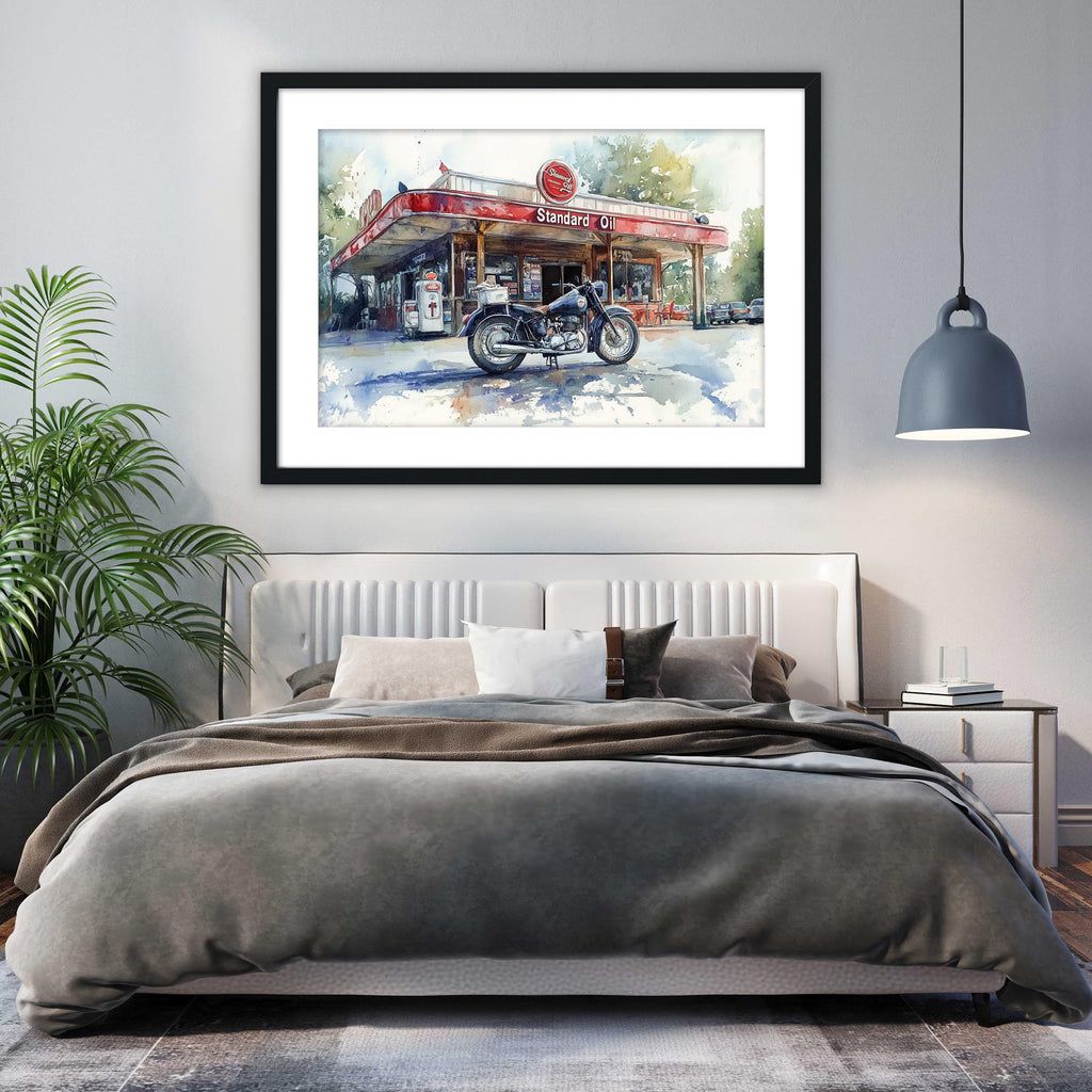 a bedroom with a large bed, a framed painting of a gas station, and a potted plant.