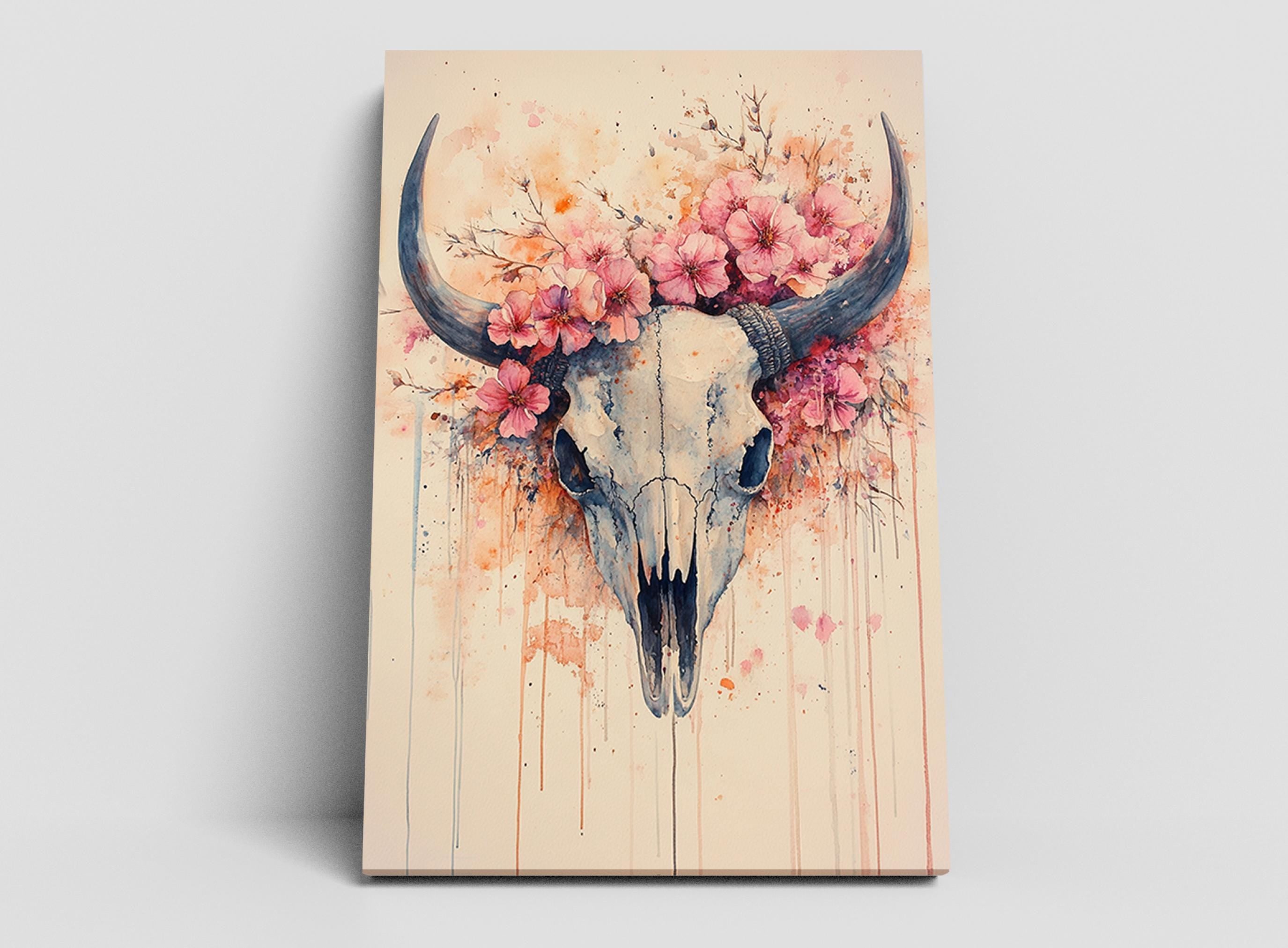 a skull adorned with pink flowers and leaves, creating a striking and artistic composition.