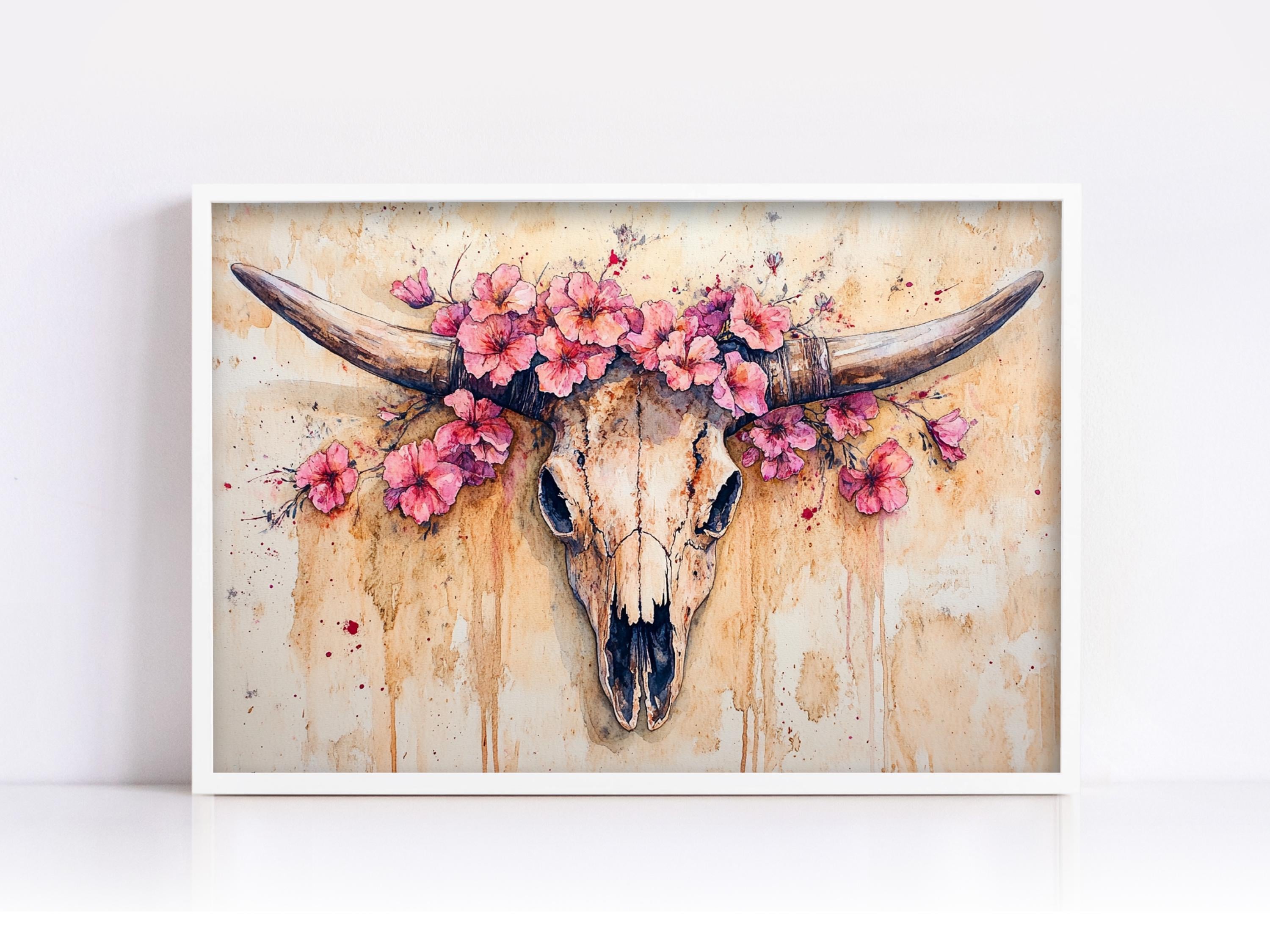 A framed painting depicting a skull with large horns adorned with pink flowers.