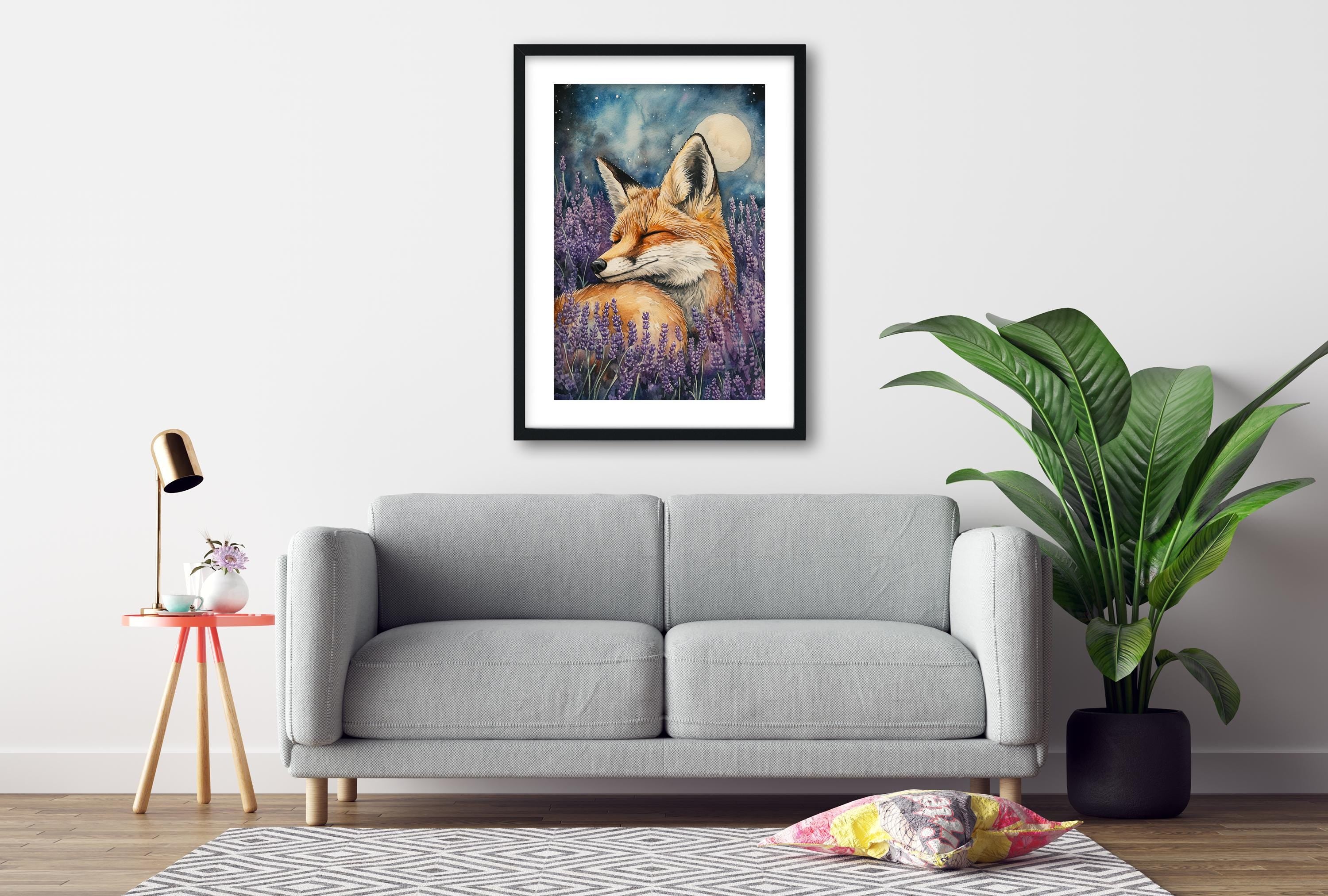 a gray sofa, a framed painting of a fox in a field of purple flowers, a small table with a lamp, and a potted plant.