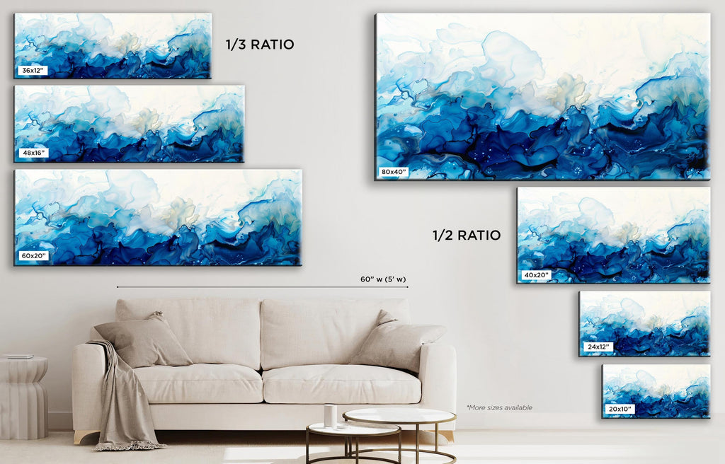 a living room with a couch and paintings on the wall