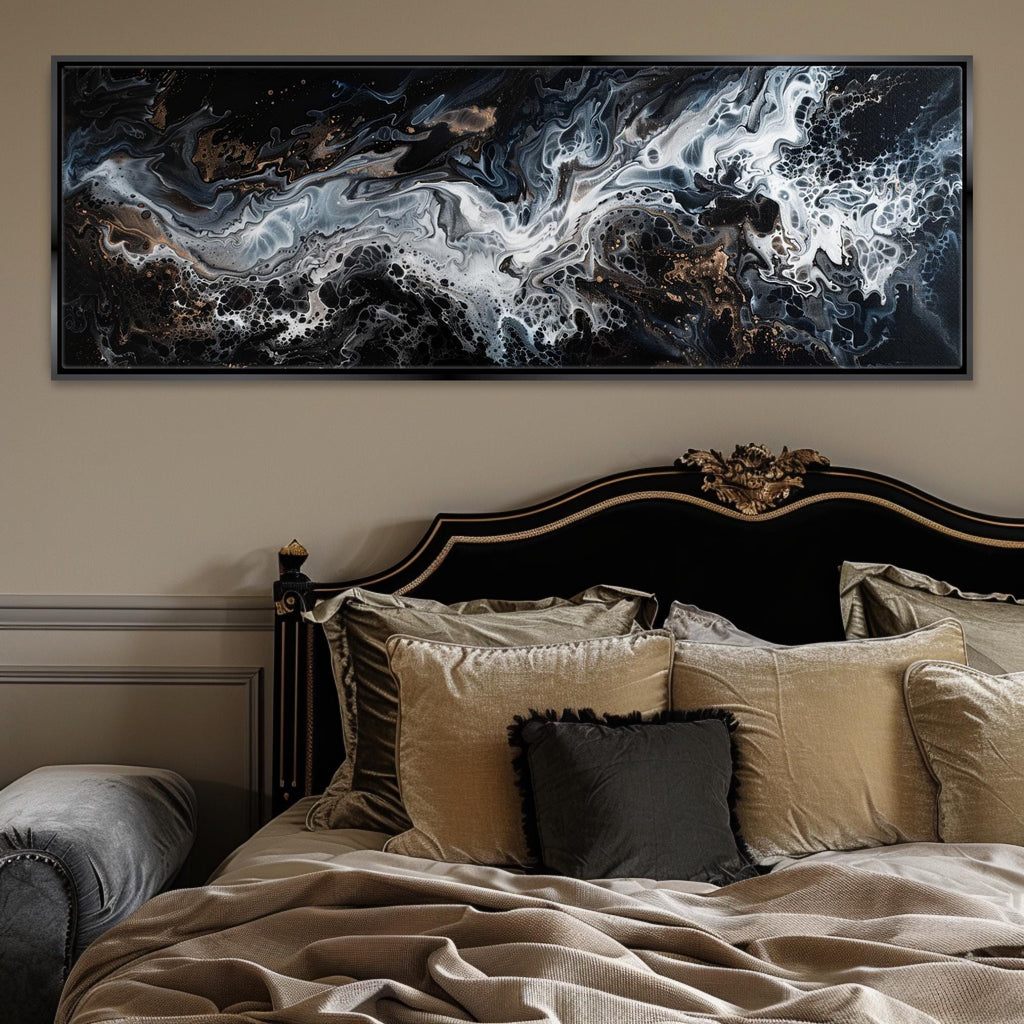 a bed with a large painting above it