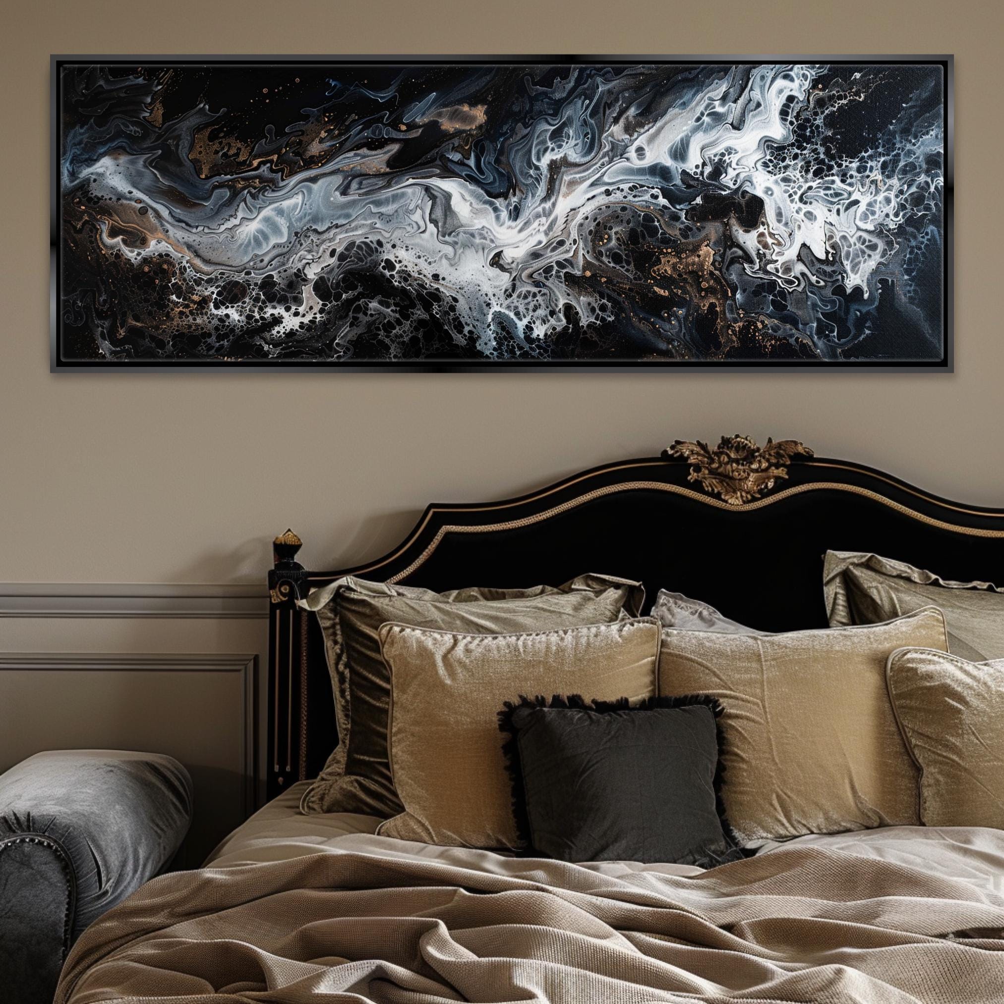 a bed with a large painting above it