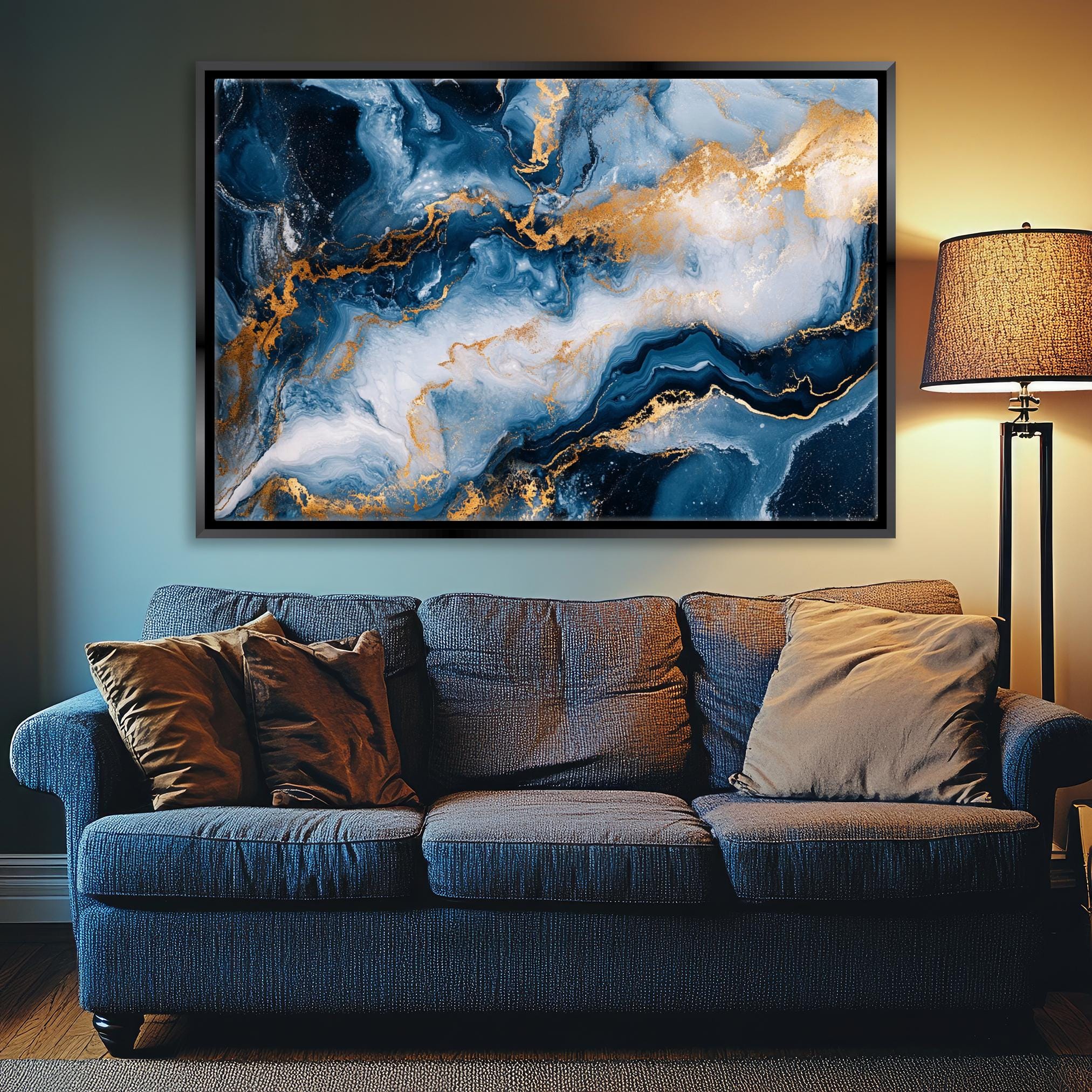 a living room with a couch and a painting on the wall