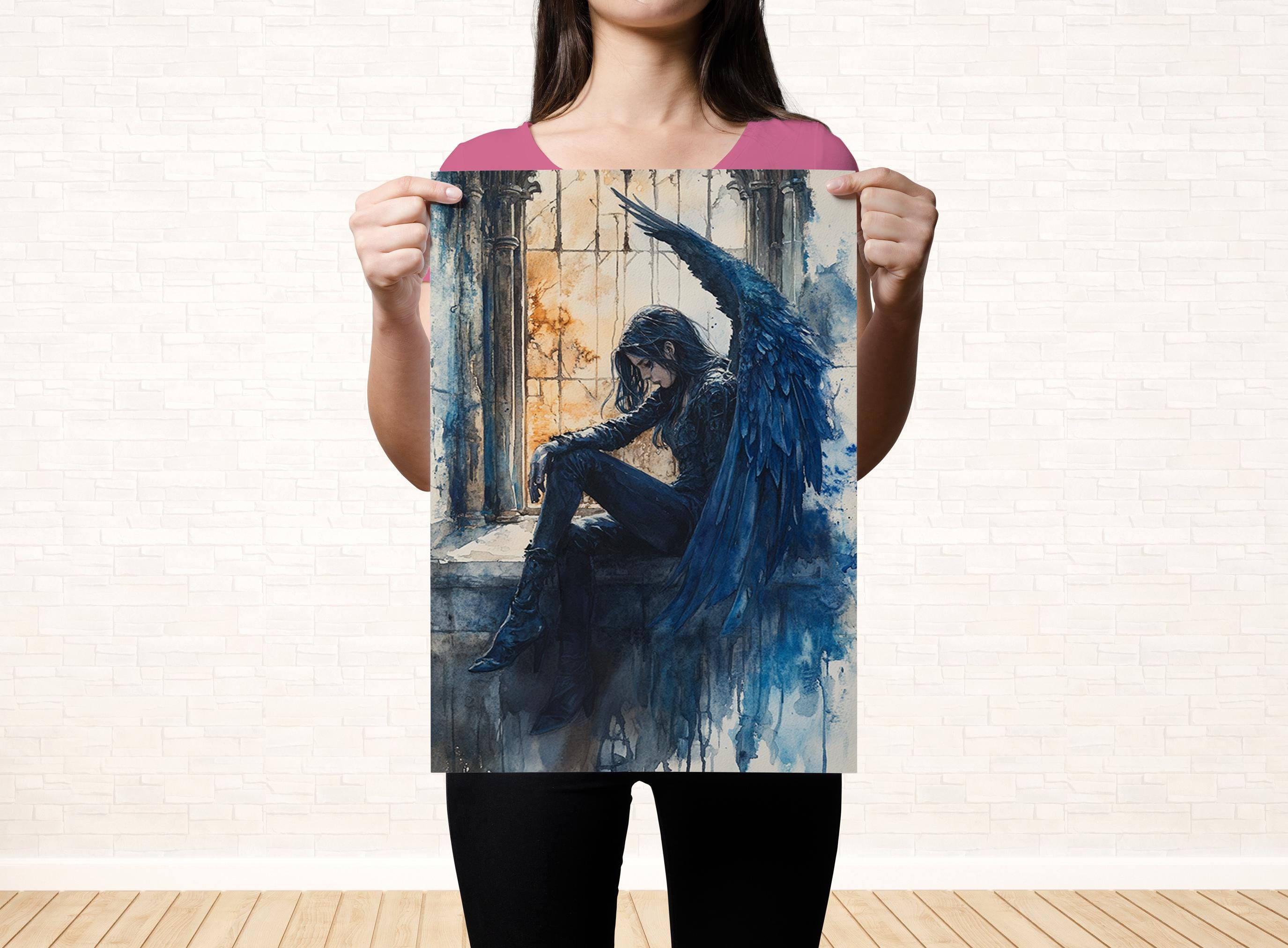 A woman is holding up a framed artwork depicting a dark, winged figure with a serious expression.