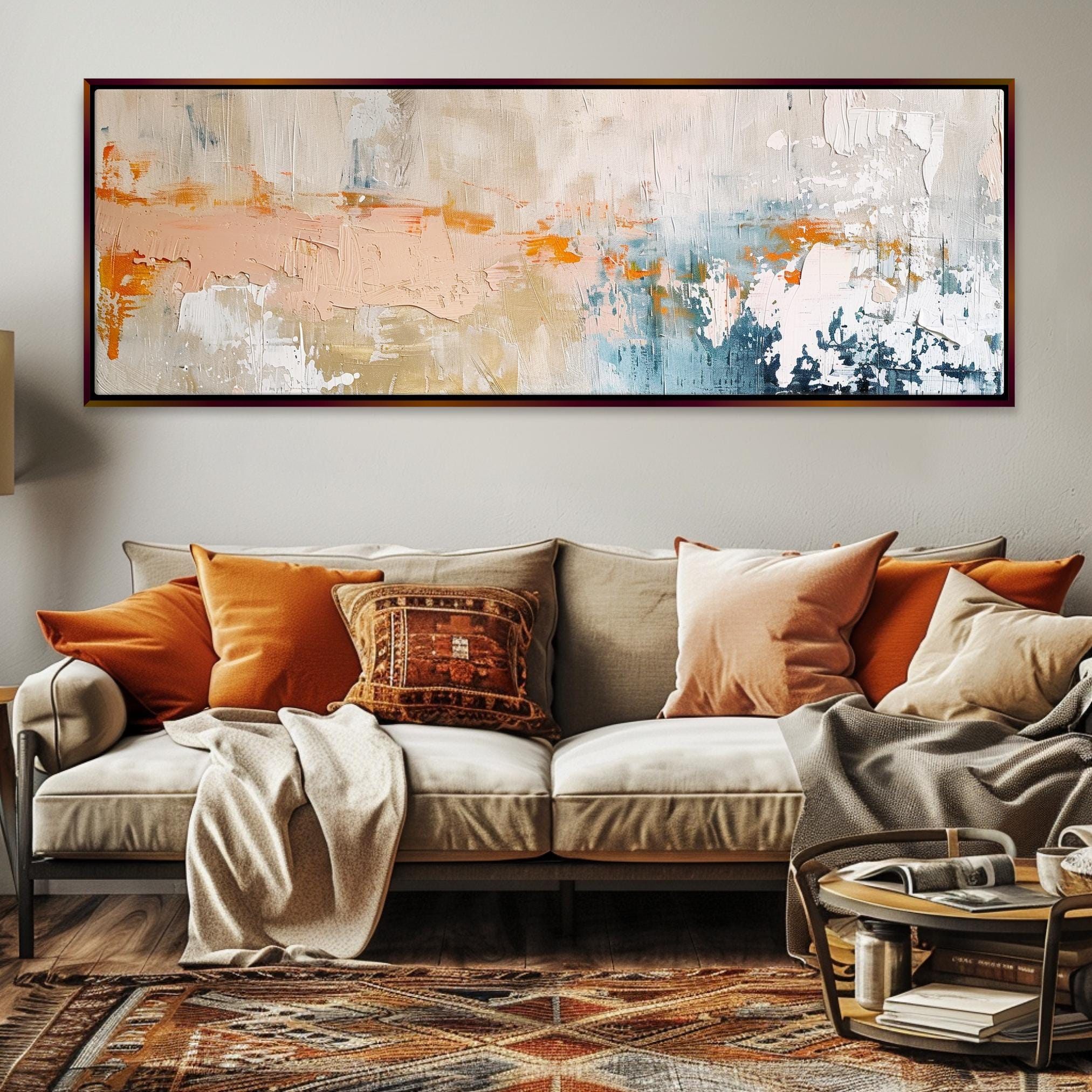 a living room with a couch and a painting on the wall