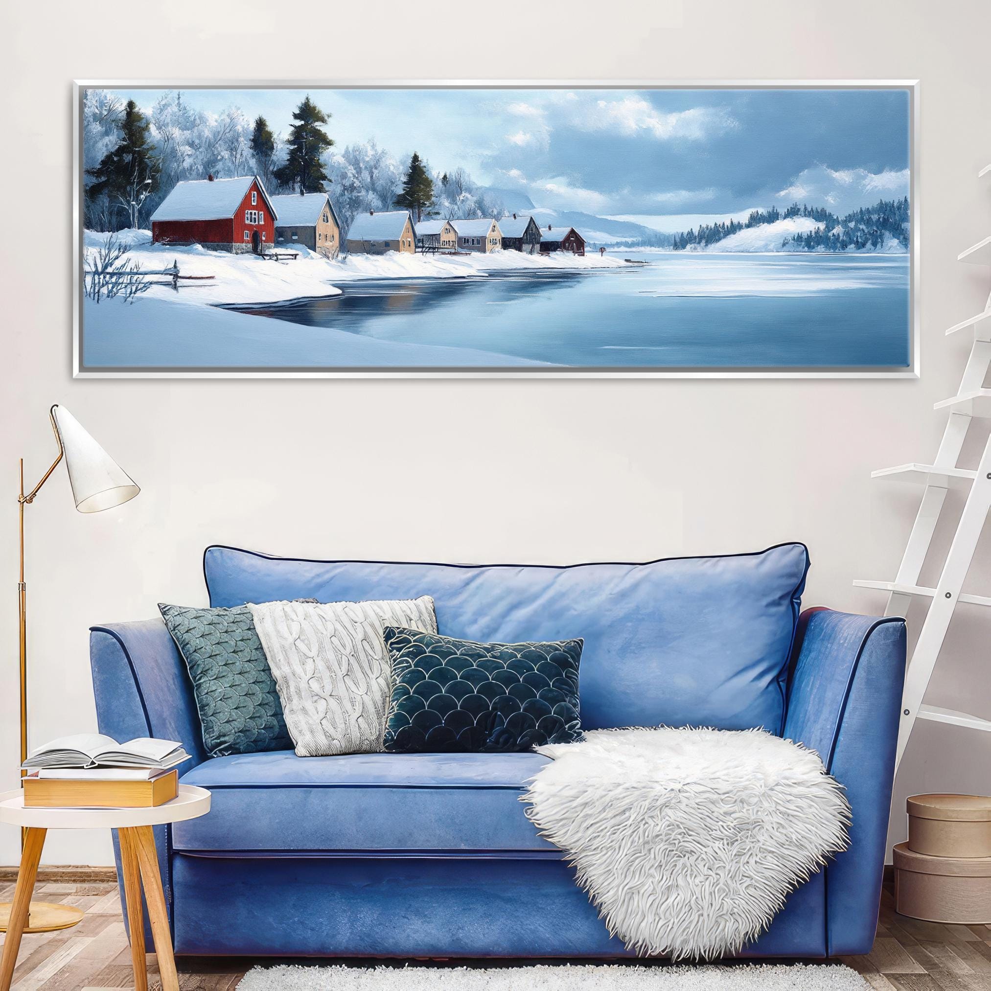 a living room with a blue couch and a painting on the wall