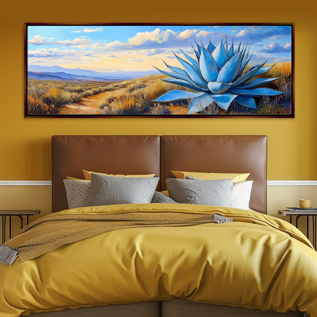a painting of a blue flower on a yellow wall above a bed