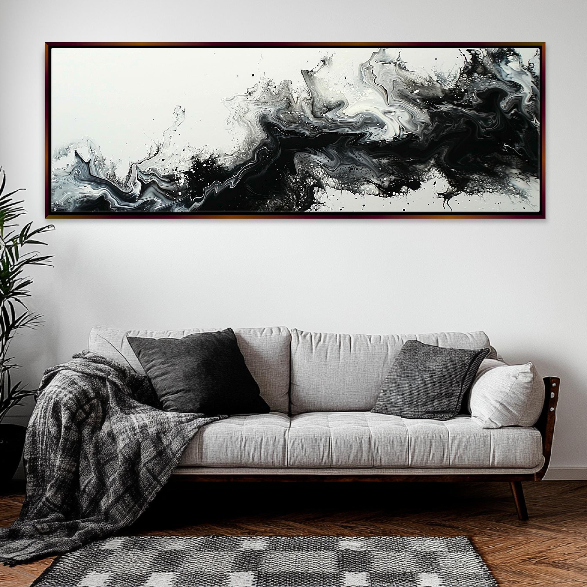 a living room with a couch and a painting on the wall
