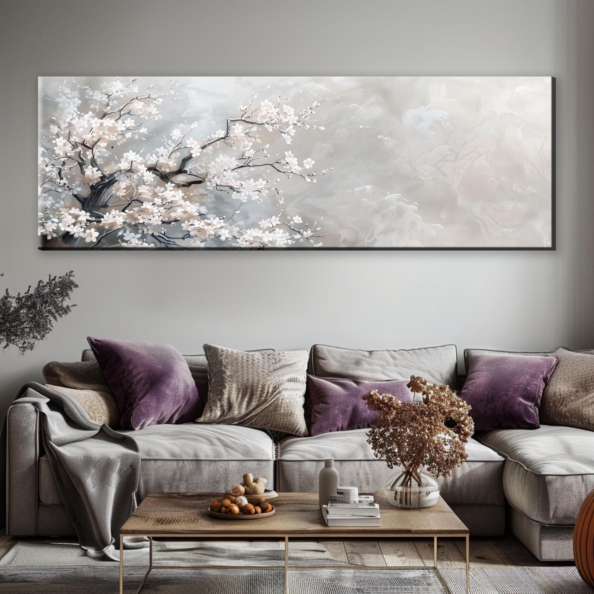 a living room with a couch, coffee table and a painting on the wall